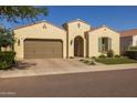 Beautiful single-story home featuring a tile roof, desert landscaping, and a two-car garage at 5258 S Verde --, Mesa, AZ 85212