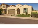 Beautiful single-story home featuring a tile roof, desert landscaping, and a two-car garage at 5258 S Verde --, Mesa, AZ 85212