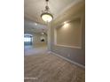 Inviting hallway featuring tile flooring, neutral paint, recessed lighting, and arched doorways leading to living spaces at 549 E Benrich Dr, Gilbert, AZ 85295