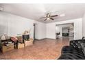 Open living space with tile flooring and a glimpse into adjoining areas at 6335 W Osborn Rd, Phoenix, AZ 85033