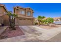 Charming two-story home with desert landscaping, and a two car garage at 7724 W Oraibi Dr, Glendale, AZ 85308