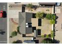 Aerial view of the property showcasing the roof, landscaping, and surrounding neighborhood at 10910 N 72Nd Dr, Peoria, AZ 85345