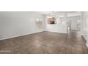 Bright and spacious living room with tile flooring, perfect for entertaining guests or relaxing with Gathering at 11871 W Sherman St, Avondale, AZ 85323