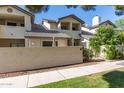 Inviting two-story home featuring a tile roof, private balcony, and well-maintained landscaping at 1222 W Baseline Rd # 119, Tempe, AZ 85283