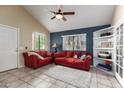 Comfortable living room features vaulted ceilings, a ceiling fan, and tile flooring for easy maintenance at 1222 W Baseline Rd # 119, Tempe, AZ 85283