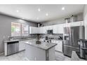 Bright kitchen featuring granite countertops, stainless steel appliances, and ample cabinet space at 1359 E 12Th St, Casa Grande, AZ 85122