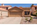 Inviting single-story home with a two-car garage and low-maintenance landscaping at 1534 E Mineral Rd, Gilbert, AZ 85234
