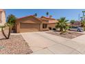 Charming single-story home with a two-car garage and xeriscape landscaping in a suburban setting at 1534 E Mineral Rd, Gilbert, AZ 85234