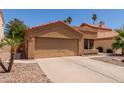 Inviting single-story home with a two-car garage and desert landscaping at 1534 E Mineral Rd, Gilbert, AZ 85234