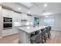 Bright, updated kitchen with a large island, sleek countertops, and stainless steel appliances at 17911 N Adobe Mesa Ct, Surprise, AZ 85374