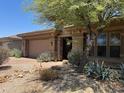 Charming single-Gathering home with a brick driveway, drought-tolerant landscaping, and stacked stone accents at 18008 W Ocotillo Ave, Goodyear, AZ 85338