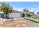 Inviting single-story home featuring an attached garage and well-maintained front yard at 2106 W 8Th Ave, Mesa, AZ 85202