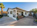 Charming home exterior with a cozy front porch, seating, and well-maintained landscaping at 2520 N 15Th St, Phoenix, AZ 85006