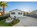 Inviting front yard featuring a fire pit area with Adirondack chairs, perfect for outdoor gatherings at 2520 N 15Th St, Phoenix, AZ 85006