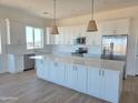 Bright kitchen with quartz countertops, white subway tile backsplash, and stainless steel appliances at 28151 N Faded Creek Dr, Florence, AZ 85132