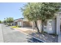 Street view of home showcasing covered carports and lush desert landscaping at 3415 N 36Th St # 3, Phoenix, AZ 85018