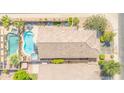 Stunning aerial view of a single Gathering home featuring a pool, spa, and outdoor seating area at 46068 W Guilder Ave, Maricopa, AZ 85139
