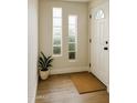 Bright entryway with wood flooring, decorative sidelight windows and a neutral color scheme at 514 N 74Th St, Scottsdale, AZ 85257