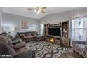Comfortable living room with modern furniture, entertainment center, and stylish decor at 650 N Hawes Rd # 2819, Mesa, AZ 85207