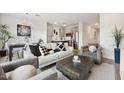 Comfortable living room features neutral furniture and an open floor plan at 7454 S 75Th Dr, Laveen, AZ 85339