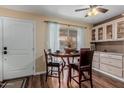 Cozy dining area with a round table and natural light from the sliding glass door at 1133 N 84Th Pl, Scottsdale, AZ 85257