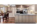 Well-lit kitchen featuring stainless steel appliances and a breakfast bar at 1133 N 84Th Pl, Scottsdale, AZ 85257