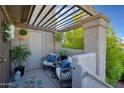 Inviting outdoor patio with pergola cover, cozy seating, and stylish decor for relaxing or entertaining at 1211 N Miller Rd # 257, Scottsdale, AZ 85257