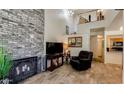 Open concept living room with fireplace, and views to kitchen and second floor loft at 1222 W Baseline Rd # 163, Tempe, AZ 85283