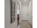 Bright foyer featuring tile flooring and a welcoming view into the home at 1560 E Squire Dr, Casa Grande, AZ 85122