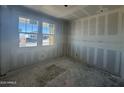Bright, unfinished bedroom with large windows and natural light exposure at 16178 W Bajada Rd, Surprise, AZ 85387
