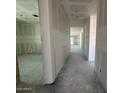 View down a long hallway with rooms and an abundance of natural light at 16178 W Bajada Rd, Surprise, AZ 85387