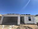 New home under construction showing the framing, garage, door and window placement on the building at 16182 W Bajada Rd, Surprise, AZ 85387