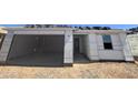 New construction features an attached garage and durable exterior material at 16182 W Bajada Rd, Surprise, AZ 85387