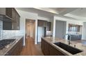 Gourmet kitchen with stainless steel appliances and gray cabinets offering plenty of storage space at 16777 W Sheila Ln, Goodyear, AZ 85395
