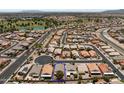 Aerial view of a single-Gathering home with a blue outline, situated in a well-planned community with a golf course at 18066 W Weatherby Dr, Surprise, AZ 85374