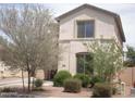 Charming two-story home with manicured landscaping and neutral-colored exterior at 21050 E Munoz St, Queen Creek, AZ 85142