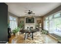 Bright dining room with hardwood floors, fireplace, modern decor and large windows at 235 W Portland St, Phoenix, AZ 85003
