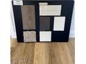 A presentation board shows flooring, cabinet, and tile options for a new construction home at 24237 W Southgate Ave, Buckeye, AZ 85326
