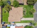 Aerial view of a home with a large yard, including a lawn, trees, and a fenced backyard at 2913 E Earll Dr, Phoenix, AZ 85016