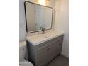 Bathroom vanity showcasing stylish design and a sleek mirror at 3421 W Montecito Ave, Phoenix, AZ 85017