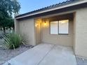 Cozy front patio area of a home, complemented by xeriscape landscaping at 3511 E Baseline Rd # 1098, Phoenix, AZ 85042