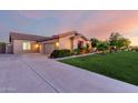 Single-story home with a three-car garage, wide driveway, and well-maintained lawn at 3531 E Norwood Cir, Mesa, AZ 85213