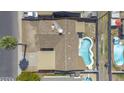 Aerial view of a residential home featuring a private pool, patio area, and well-maintained roof at 3823 W Rose Ln, Phoenix, AZ 85019