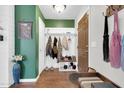 Bright entryway featuring stylish hooks, a coat rack, and a convenient shoe storage bench at 40638 N High Meadows Dr, San Tan Valley, AZ 85140