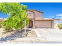 Charming two-story home with a two-car garage and mature landscaping, creating inviting curb appeal at 40638 N High Meadows Dr, San Tan Valley, AZ 85140
