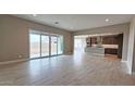 Open living area with tile floors, neutral walls, recessed lights and access to backyard through sliding glass doors at 4227 W Adobe Dr, Eloy, AZ 85131