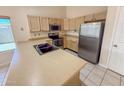 Bright kitchen featuring stainless steel appliances and light wood cabinetry at 4332 E Stanford Ave, Gilbert, AZ 85234