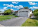 Charming single-story home with paved driveway and attached two-car garage at 4842 E Fairmount Ave, Phoenix, AZ 85018