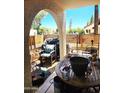 Cozy patio area with seating, a grill, and privacy fencing at 5136 E Evergreen St # 1053, Mesa, AZ 85205