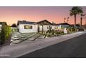 Inviting single-Gathering home showcasing manicured landscaping and modern design at 8708 E Rancho Vista Dr, Scottsdale, AZ 85251